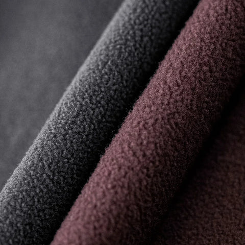 Close-up of textured black and brown fabric on a dark background
