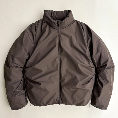 Brown jacket on a light beige background