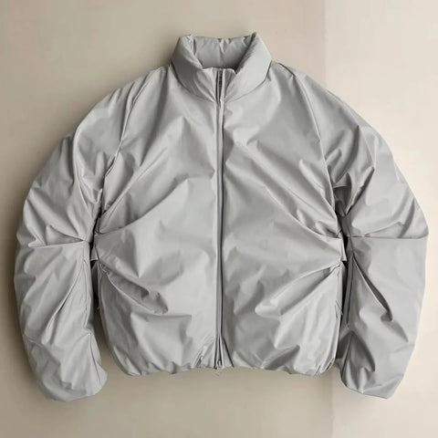 Light gray jacket on a beige background
