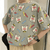 Camiseta holgada con estampado gráfico y cuello redondo